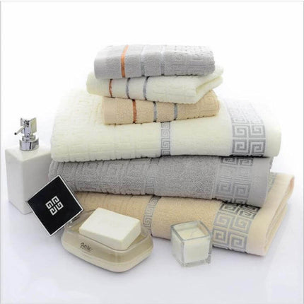 Three-Piece Cotton Towel Bath Set For Everyday Use stacked neutral towels with soap and lotion, bath towel 70x140 cm and two 34x70 cm towels