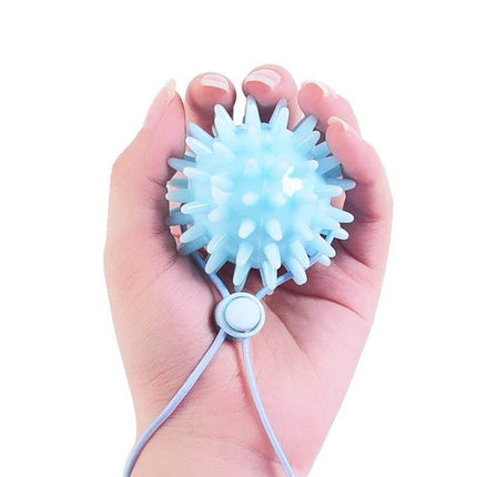 TPR Grip Ball Hand Rehabilitation 6cm Easy Grip Palm Massage - blue spiky TPR therapy ball held in palm for grip strengthening