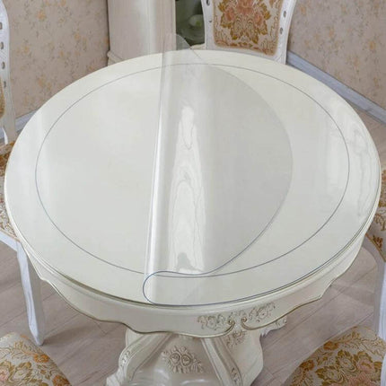 Transparent Soft Glass Tablecloth, Waterproof 90x120 on round white wooden table showing clear protective PVC surface guarding against spills and stains
