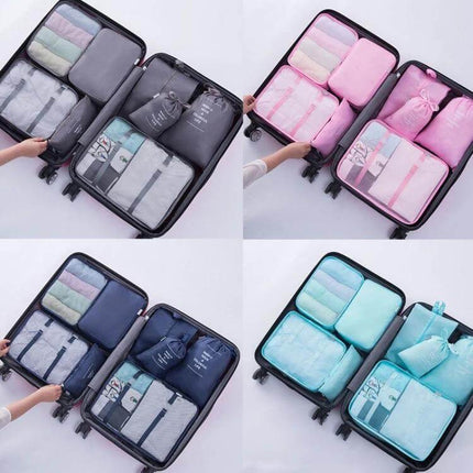 Travel Storage Bag Set For Clothes Organization 10 In 1 neatly packed inside open suitcase showing multiple color packing cubes and buckle-secured compartments