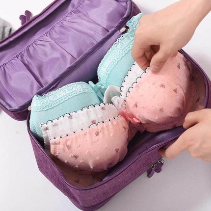 Travel Waterproof Underwear Storage Bag for Travel packed purple toiletry bag with bras and socks organized in transparent inner compartments