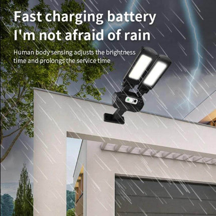 Two-Head Solar Motion Light For Outdoor Wall Ideal For Doorways mounted on exterior wall in rain showing dual COB LEDs and solar panel