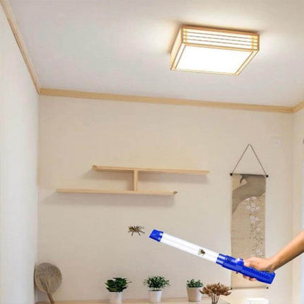 USB Charging Insect Catcher With LED Light For Home Use Blue shown in a living room catching a flying insect, USB rechargeable, quiet, chemical-free