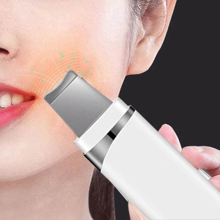 Ultrasonic Blackhead Remover Pore Cleaner For Facial Care handheld device gently exfoliating and cleansing pores on cheek