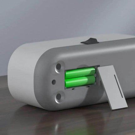 Ultrasonic Cleaner for Jewelry and Glasses, Rechargeable showing open battery compartment with three replaceable green batteries