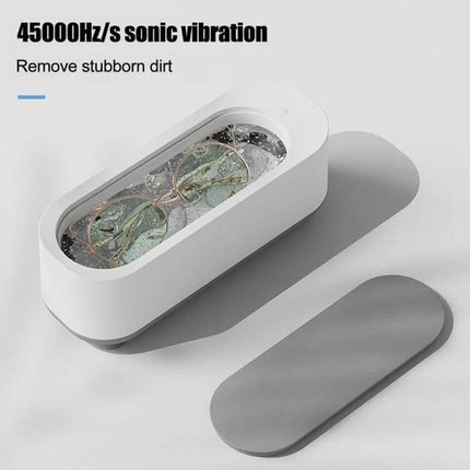 Ultrasonic Cleaner for Jewelry and Glasses, Rechargeable white compact unit cleaning eyeglasses with 45000Hz/s sonic vibration