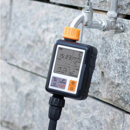 Universal LCD Sprinkler Controller for Outdoor Garden Irrigation attached to outdoor faucet showing LCD timer and hose connection