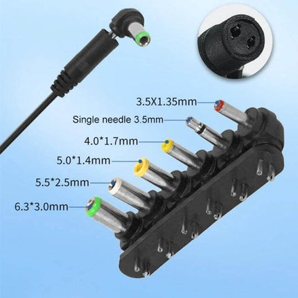 Universal Power Adapter With Seven Plugs For Home Electronics showing seven interchangeable DC tips and voltage labels (3.0–12.0V)