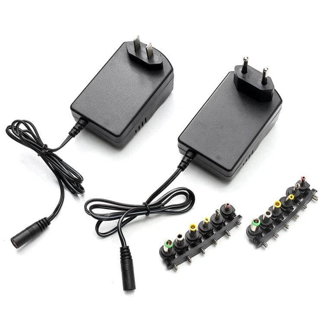 Universal Power Adapter With Seven Plugs For Home Electronics - black multi-voltage DC adapter with interchangeable plug tips