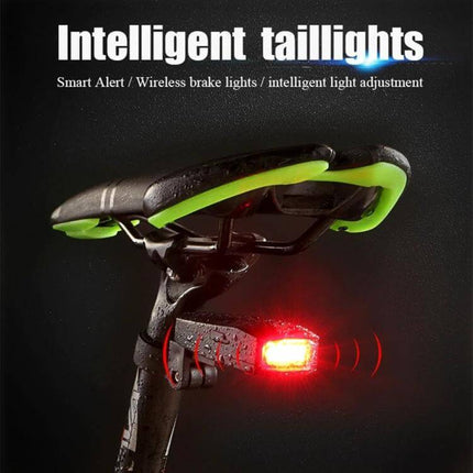 USB Rechargeable Smart COB LED Bicycle Taillight IP65 Waterproof mounted under saddle glowing red on wet city bike at night