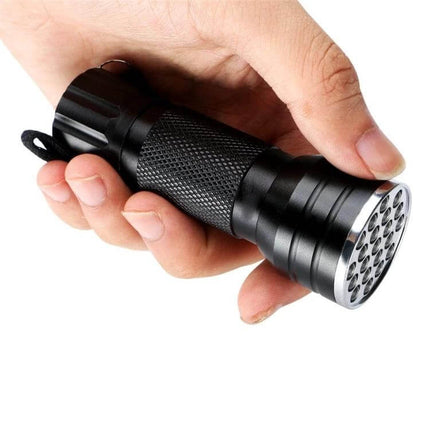 UV 21 LED Flashlight For Pet Urine Stains Detector - compact black EDC UV torch with 21 LEDs in hand for finding hidden pet stains