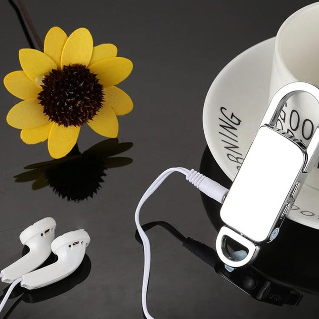 Keychain Voice Recorder for Daily Notes and Music Playback compact 8GB recorder with earbuds on black surface