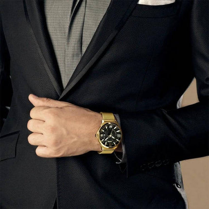 SKMEI Everyday Men's Waterproof Fashion Business Watch on wrist with gold case and black dial, styled with a business suit for daily wear