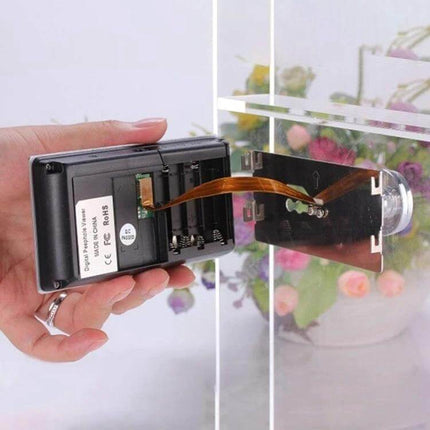 Digital Security Camera Peephole Door Viewer with 3.5-Inch Screen showing handheld installation and battery compartment