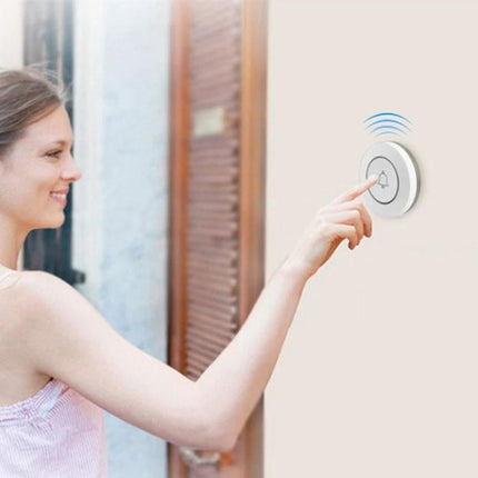 Wireless Anti-Theft Doorbell Button for Home Security mounted on doorframe with woman pressing wireless alert button