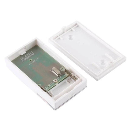 VOYE Home Wireless Remote Control Doorbell with Various Sounds white wireless doorbell transmitter opened showing battery compartment and circuit board