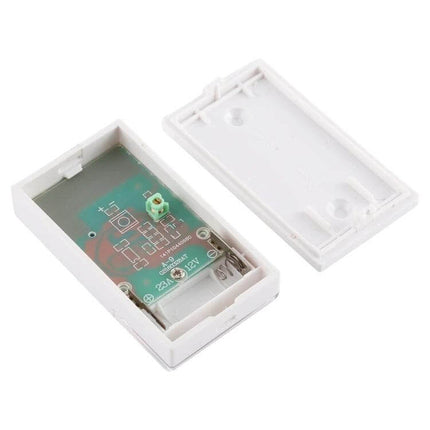 Voyage Wireless Music Doorbell with Plug-in Design for Easy Home Installation showing open white transmitter case and circuit board