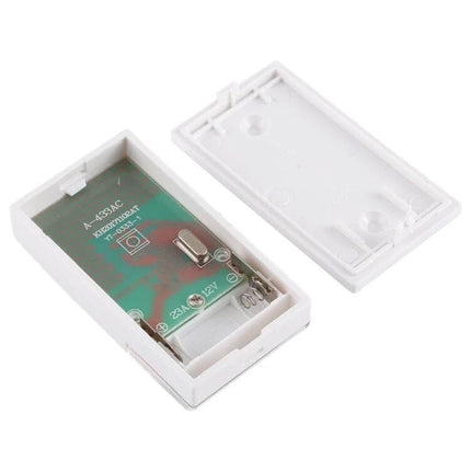 Voyé Wireless Plug-in Doorbell for Easy Home Notifications white plastic plug-in chime unit with open back showing battery compartment and circuit board