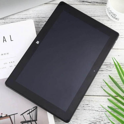 Versatile 10.1 Inch Tablet PC for Daily Computing Tasks showing black tablet with Windows logo on wooden desk and accessories