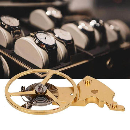 Watch Balance Cockpit Repair Tool Durable for Watch Repairs – gold balance wheel and hairspring assembly on workbench with finished wristwatches in background