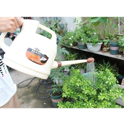 Watering Can 7L For Home Garden And Indoor Plants Everyday ergonomic 7L can with long spout pouring over potted herbs and houseplants