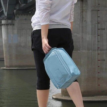 Waterproof Shoes Bag Organizer 30x21x11 cm Travel Pouch light blue nylon travel shoe pouch held by woman near water