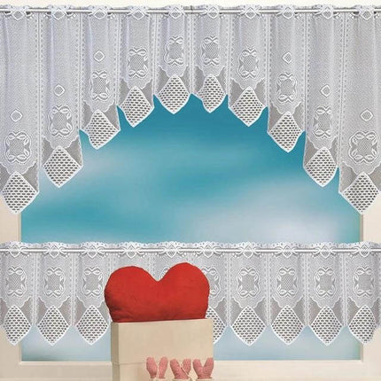 White Translucent Lace Curtain Panels For Bedroom Windows hung on a window with scalloped edges and heart pillow in foreground