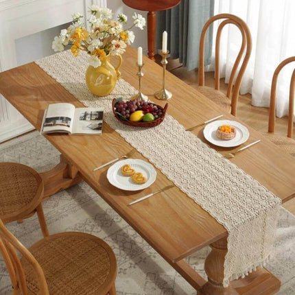 Widened And Stitched Rustic Knitted Hollow Table Runner 30x180cm draped on wooden dining table with vase and candles