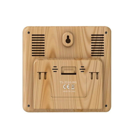 Wireless Weather Clock With Wood Grain Finish For Home Use — rear view showing wood grain casing, battery compartment and wall-mount slot