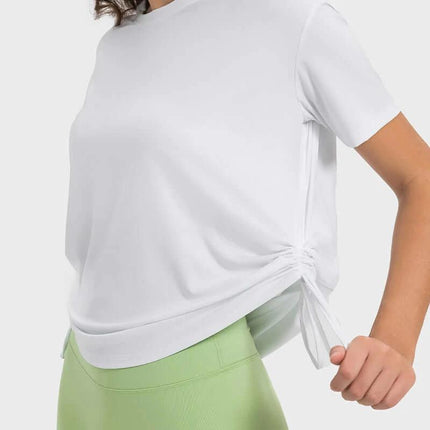 Women's Short Sleeve Side Drawstring Yoga Top Cotton Blend in white showing side drawstring cinch and hip-length fit
