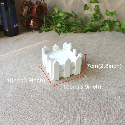 Wooden Flower Planter Fence Pot, White Wood, 10cm Square on windowsill with small succulents and ivy backdrop
