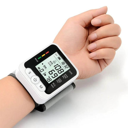Wrist Blood Pressure Monitor With Voice For Home Use on wrist showing systolic diastolic and pulse readings, compact travel-friendly cuff
