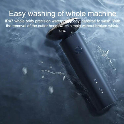 Xiaomi Electric Shaver Grey For Daily Home Grooming showing waterproof design being rinsed under water