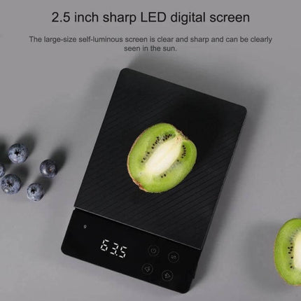 Xiaomi Kitchen Scale With Tare Function For Precise Ingredient Measurement clear LED display showing weight of kiwi on scale