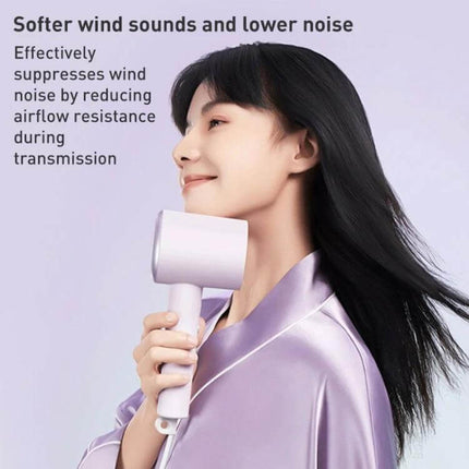 Xiaomi Mijia Hair Dryer Green For Quick Drying And Everyday Use woman using compact green dryer for fast, low-noise drying and styling