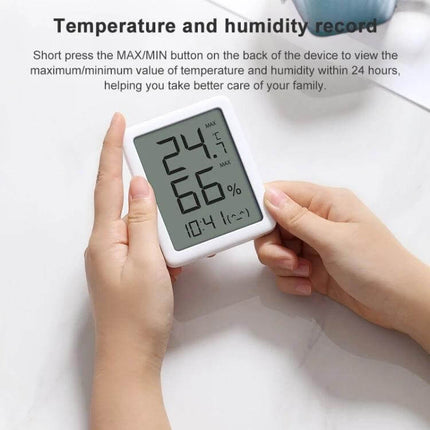 Xiaomi Youpin Miaomiaoce LCD Hygrometer to Monitor Indoor Humidity showing 24.5°C and 66% RH on desktop display, compact wall or desk use