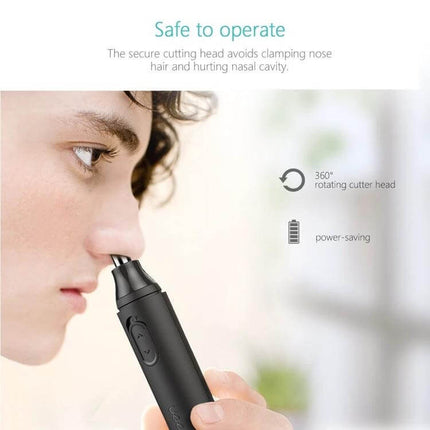 XPREEN Nose and Ear Hair Trimmer With Rotating Blade For All showing close-up use on nostril with 360-degree rotating blade, compact black trimmer