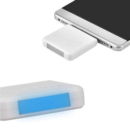 Micro USB RFID Card Reader for Smartphone Tag Scanning Applications plugged into Android phone showing compact white reader with NFC symbol and blue indicator light