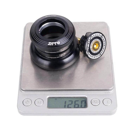 ZTTO Bicycle Headset For 44mm Headtube Smooth Steering For Daily Rides - lightweight black aluminum headset with sealed bearings shown on scale (126g)