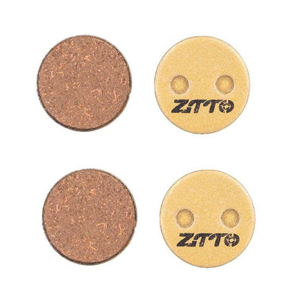 ZTTO Mountain Bike Brake Pads Full Metal Copper Base round copper backing pair showing ZTTO logo, durable low-noise pads for trail and urban riding