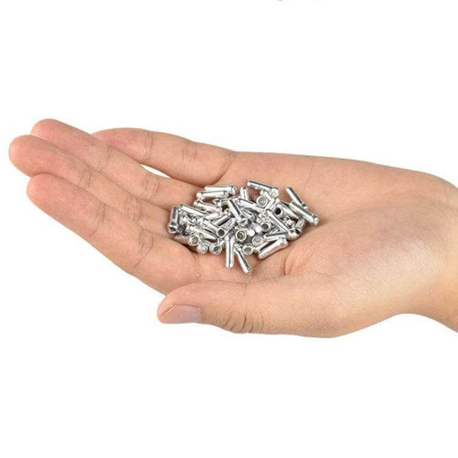 ZTTO Aluminum Bicycle Brake Shifter Bobbin Caps 100 Pack shown as silver aluminum cable end caps displayed in an open hand
