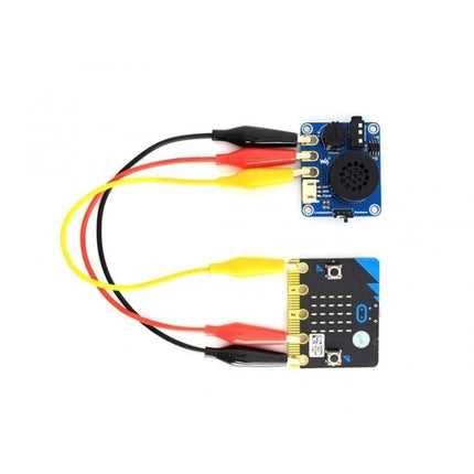 Waveshare Micro:bit Compatible Speaker for Music Playback connected to micro:bit with alligator clip wires showing speaker module and board