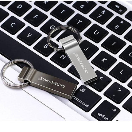 Portable MicroDrive 4GB Metal Keychain USB Storage Drive on laptop keyboard showing two metal keychain flash drives attached to rings