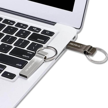 Portable MicroDrive 4GB Metal Keychain USB Storage Drive attached to laptop USB port, compact metal keychain flash drive for students and professionals