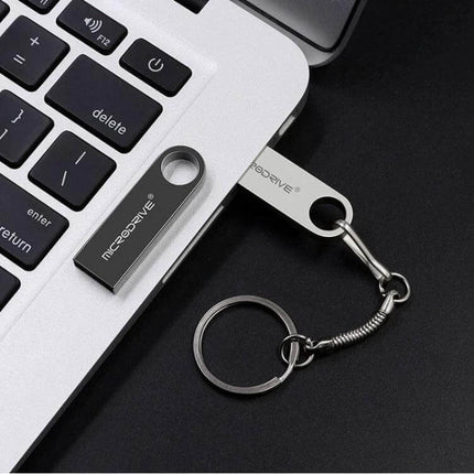 MicroDrive 16GB USB Flash Drive for File Storage and Transfer slim metal keyring USB plugged into laptop