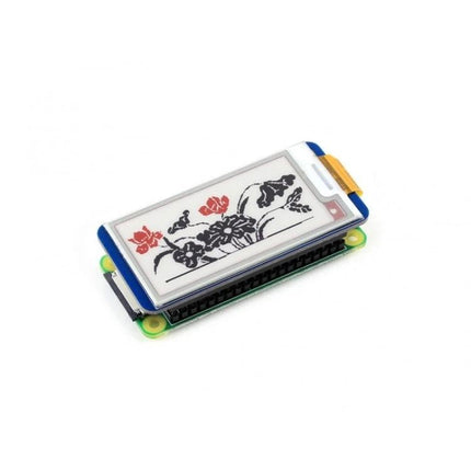 Waveshare 2.13 Inch Three-Color E-Ink Display for Raspberry Pi showing red and black floral demo image on HAT for low-power shelf labels and monitoring
