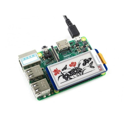 Waveshare 2.13 Inch Three-Color E-Ink Display for Raspberry Pi mounted on Raspberry Pi showing floral three-color demo image