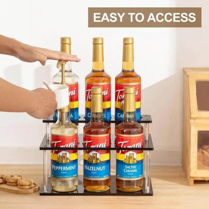 Acrylic 2-Tier Coffee Syrups Bottle Rack Organizer holding six syrup bottles on countertop with clear tiers for easy access and visible labels