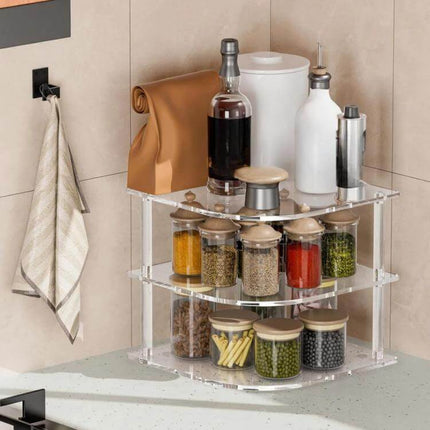 Acrylic 3 Tier Corner Plates and Bowls Organizer Shelf shown storing jars, bottles and kitchen items on a countertop corner for compact organization