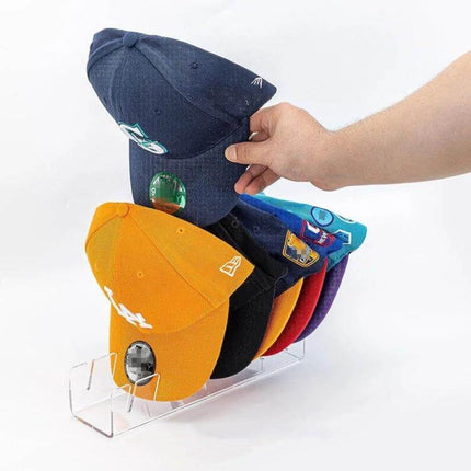 Acrylic Baseball Cap Holder Stores 7 Caps For Easy Countertop Organization – clear 7-cap acrylic rack showing stacked baseball hats on countertop
